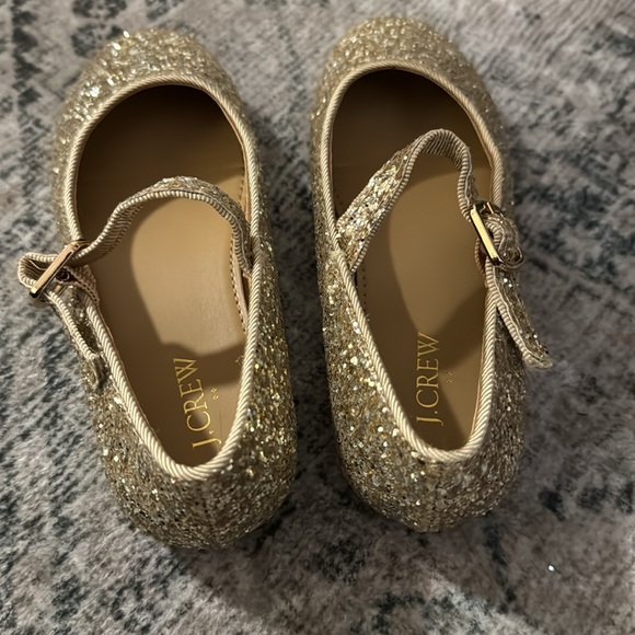 Girls hold sparkle shoes - Picture 2 of 2